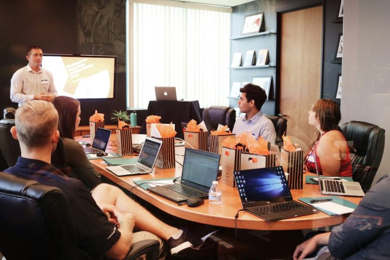 Presenter discussing data with an audience during a business presentation